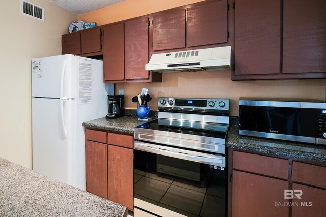 kitchen with appliances with stainless steel finishes and tile patterned floors