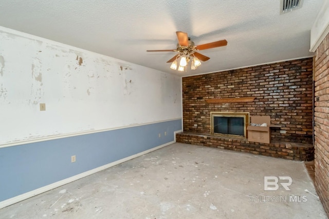 3909 Blue Gill Cir, Mobile, AL 36619 - unfurnished living room with a ceiling fan, a brick fireplace, a textured ceiling, and brick wall