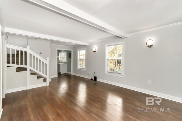 unfurnished living room featuring stairway, ornamental molding, wood finished floors, beamed ceiling, and baseboards