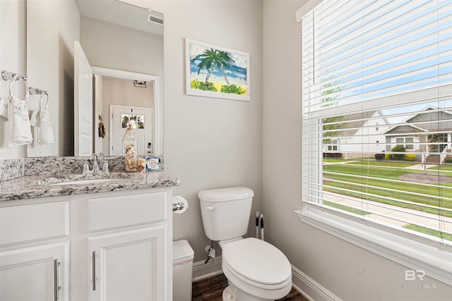 1213 Primrose Ln, Foley, AL 36535 - bathroom with toilet, healthy amount of natural light, baseboards, and vanity