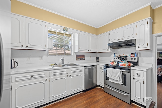 kitchen featuring dark wood-type flooring, stainless steel appliances, and white cabinets