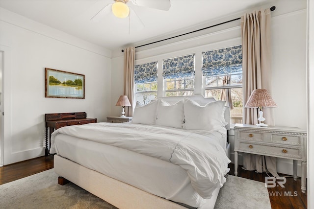 bedroom with a ceiling fan and wood finished floors