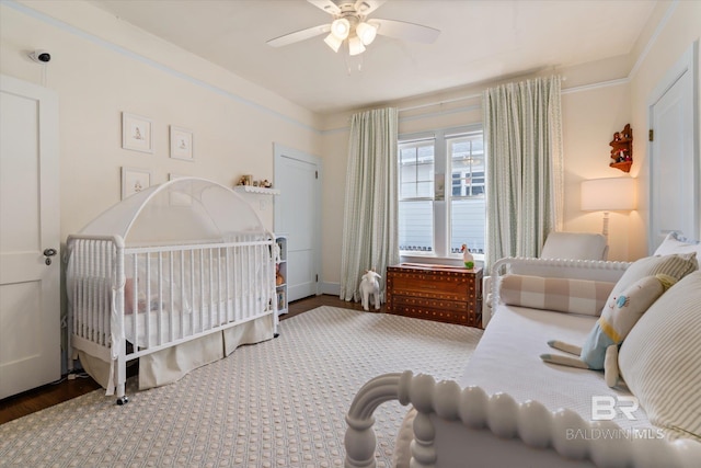 bedroom featuring a ceiling fan and wood finished floors