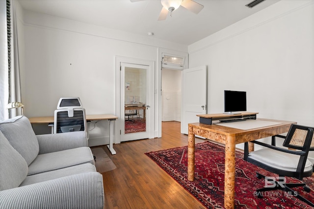 office featuring visible vents, ceiling fan, and wood finished floors