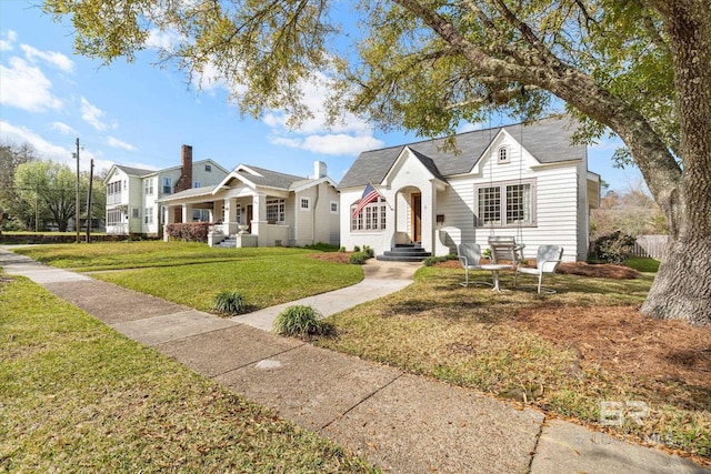 view of front of property with a front yard and fence