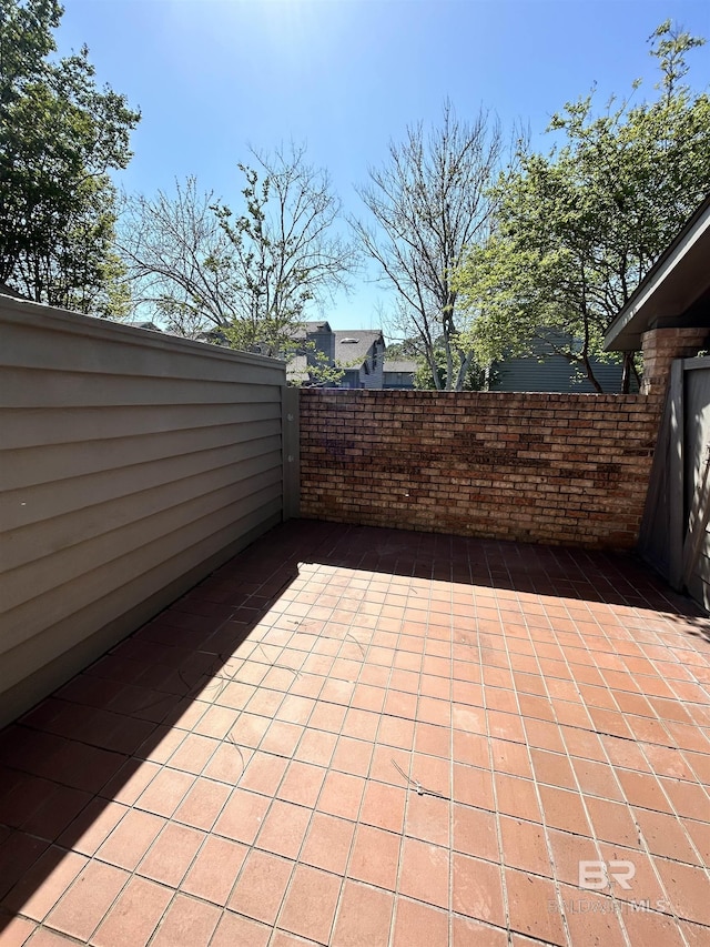 view of patio featuring fence
