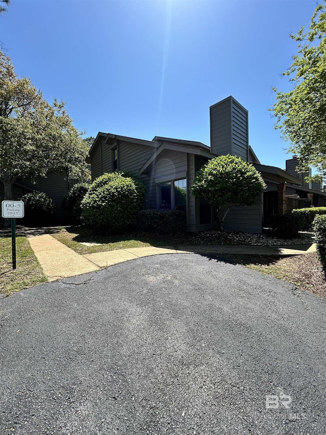 view of home's exterior with a chimney