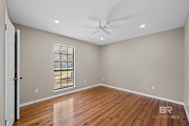 unfurnished room with light wood-style flooring, baseboards, ceiling fan, and recessed lighting