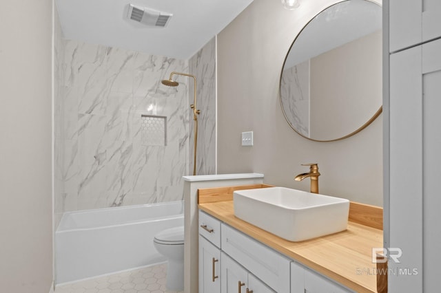 full bath featuring bathtub / shower combination, visible vents, vanity, and toilet