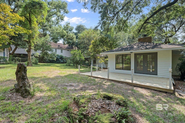 view of yard with french doors