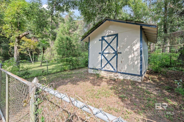 view of shed featuring a fenced backyard