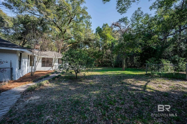 view of yard featuring fence