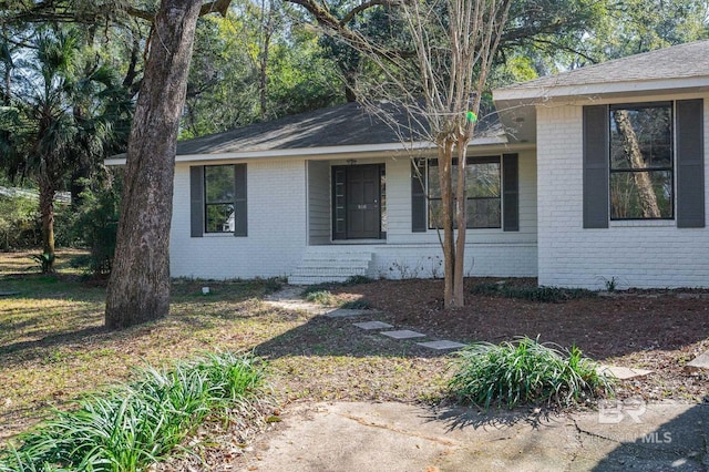 view of home's exterior with brick siding