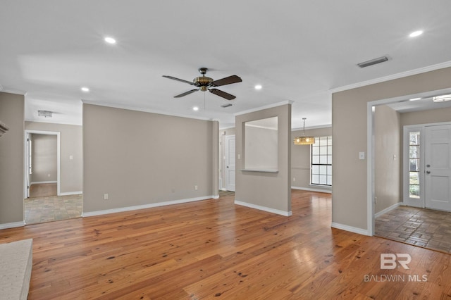 unfurnished living room featuring light wood-type flooring, visible vents, crown molding, and recessed lighting