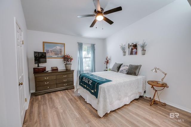 bedroom with ceiling fan and light hardwood / wood-style flooring