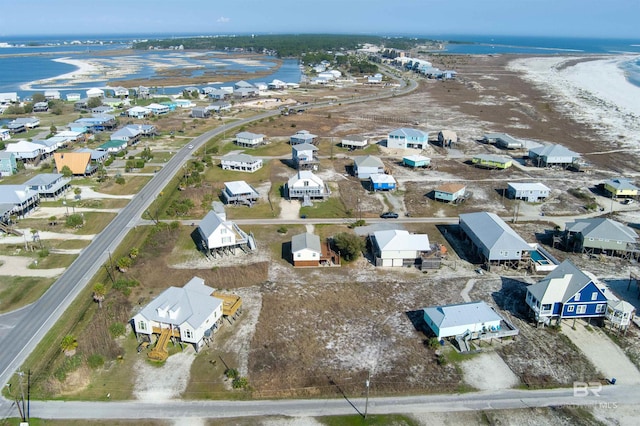 108 Ponchartrain Ct, Dauphin Island, AL 36528 - aerial view of property's location featuring a large body of water and nearby suburban area