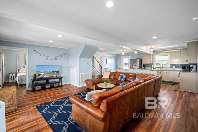 108 Ponchartrain Ct, Dauphin Island, AL 36528 - living room featuring recessed lighting, dark wood-style floors, and stairs