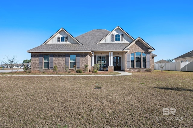 craftsman-style house with a front lawn