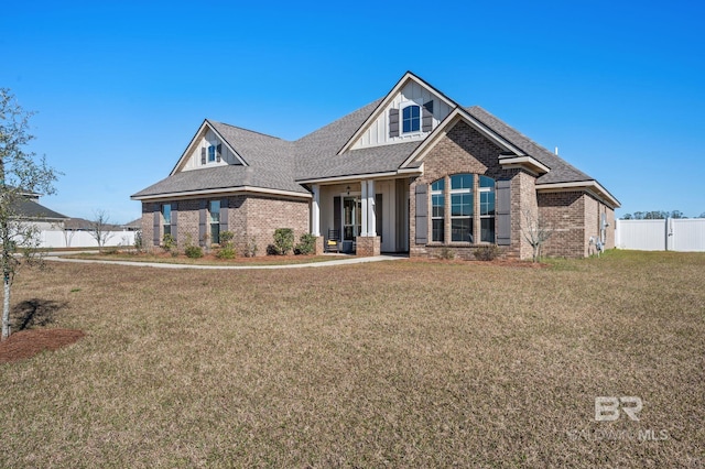 craftsman-style house featuring a front yard