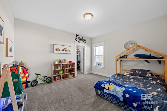 carpeted bedroom with a spacious closet