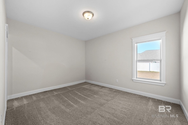 unfurnished room featuring carpet floors