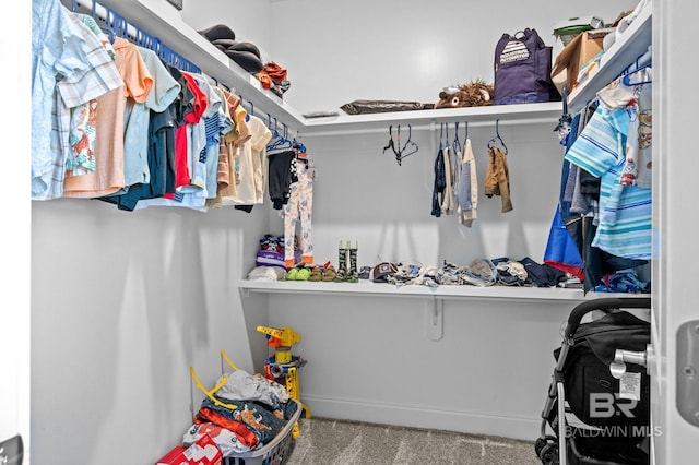 spacious closet featuring carpet