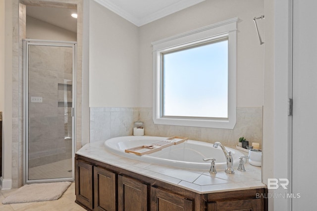 bathroom featuring tile patterned floors, independent shower and bath, and ornamental molding