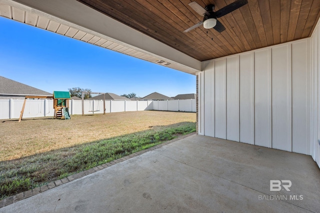 view of patio / terrace with ceiling fan and a playground