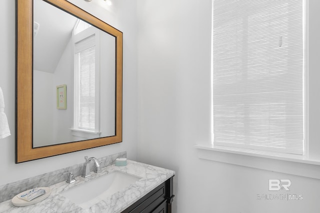 2457 Saltgrass Way Unit 8, Orange Beach, AL 36561 - bathroom with vanity and vaulted ceiling