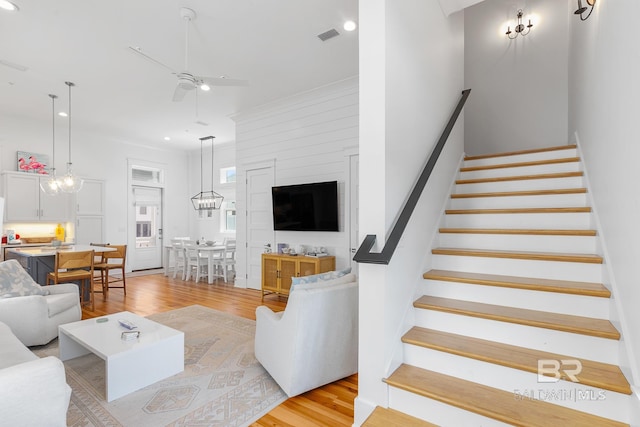 2457 Saltgrass Way Unit 8, Orange Beach, AL 36561 - living area featuring recessed lighting, stairway, light wood-type flooring, and a ceiling fan