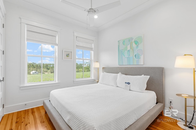 2457 Saltgrass Way Unit 8, Orange Beach, AL 36561 - bedroom featuring baseboards, attic access, and wood finished floors