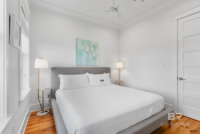 2457 Saltgrass Way Unit 8, Orange Beach, AL 36561 - bedroom featuring baseboards, a ceiling fan, and wood finished floors