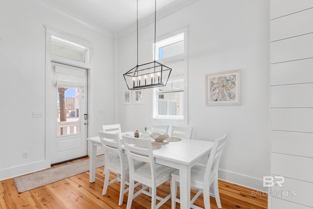 2457 Saltgrass Way Unit 8, Orange Beach, AL 36561 - dining area featuring baseboards, an inviting chandelier, and wood finished floors