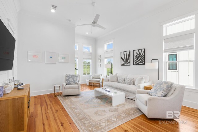 2457 Saltgrass Way Unit 8, Orange Beach, AL 36561 - living room featuring crown molding, a ceiling fan, visible vents, recessed lighting, and wood finished floors