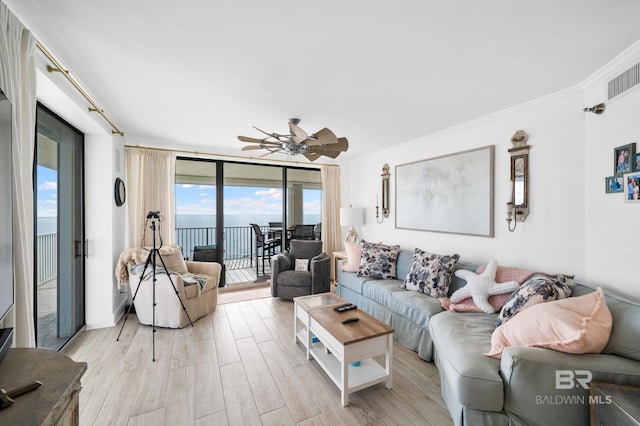 24900 Perdido Beach Blvd Unit 1001, Orange Beach, AL 36561 - living room featuring expansive windows, a water view, crown molding, ceiling fan, and light wood-type flooring