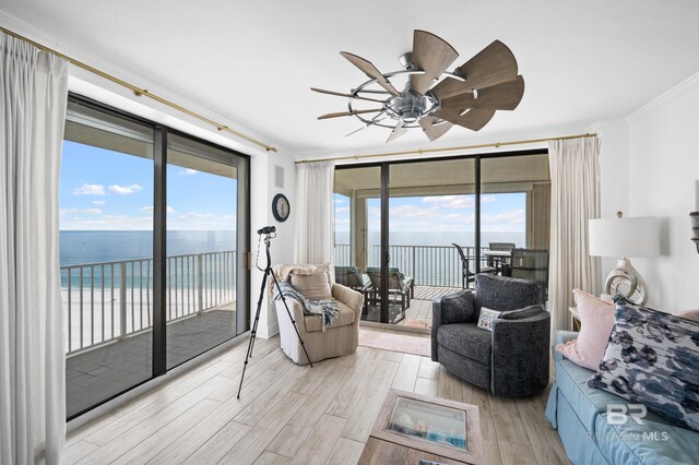 24900 Perdido Beach Blvd Unit 1001, Orange Beach, AL 36561 - living room with a water view, crown molding, and light hardwood / wood-style floors