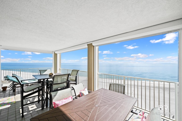 24900 Perdido Beach Blvd Unit 1001, Orange Beach, AL 36561 - sunroom featuring a water view and a beach view