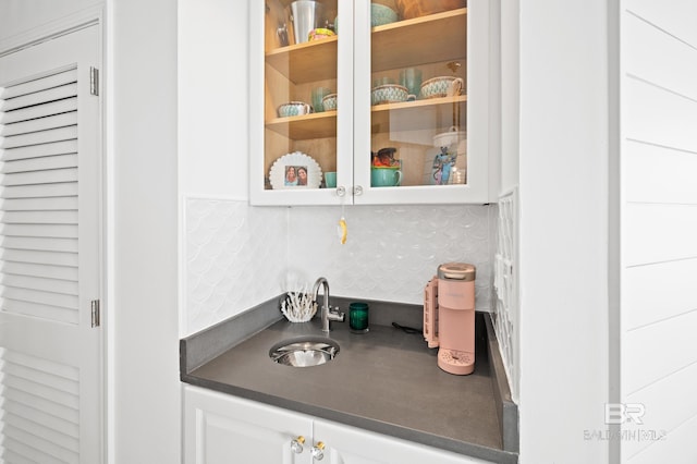 24900 Perdido Beach Blvd Unit 1001, Orange Beach, AL 36561 - bar featuring tasteful backsplash, white cabinetry, and sink