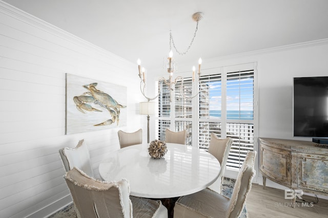 24900 Perdido Beach Blvd Unit 1001, Orange Beach, AL 36561 - dining room with crown molding, a chandelier, and wood-type flooring