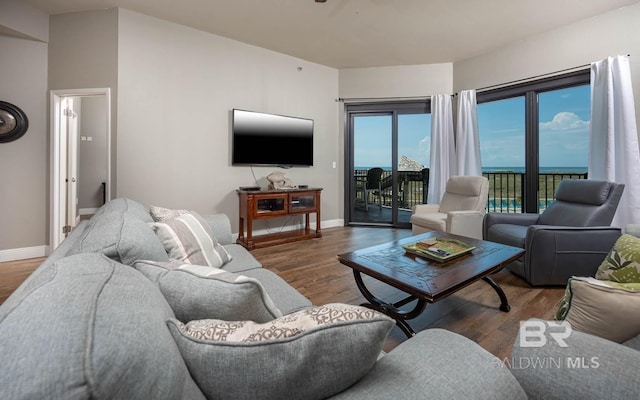 living area featuring wood finished floors and baseboards