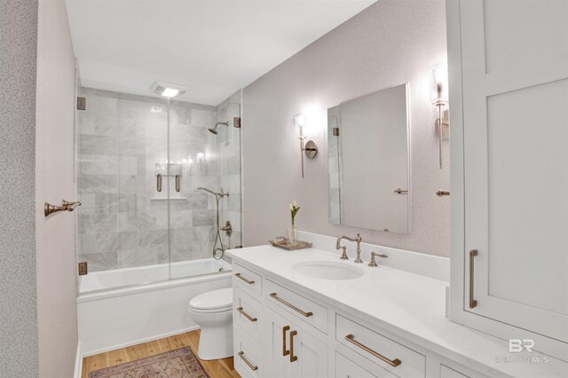210 S Mobile St Unit 16, Fairhope, AL 36532 - full bath featuring toilet, vanity, wood finished floors, and enclosed tub / shower combo