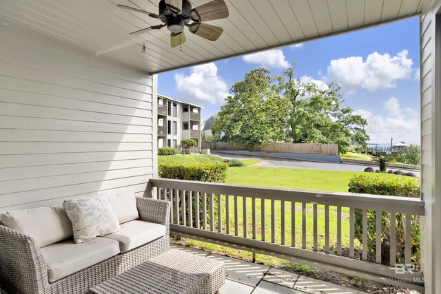 210 S Mobile St Unit 16, Fairhope, AL 36532 - balcony featuring a ceiling fan