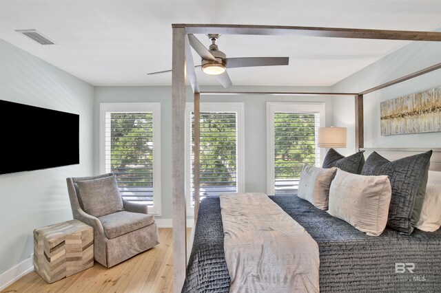 210 S Mobile St Unit 16, Fairhope, AL 36532 - bedroom featuring multiple windows, wood finished floors, and baseboards