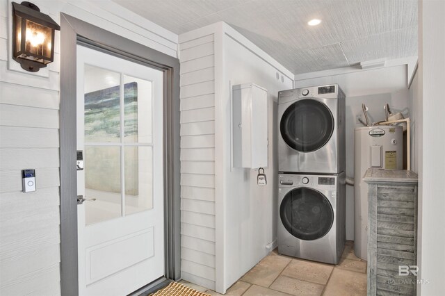 210 S Mobile St Unit 16, Fairhope, AL 36532 - laundry room featuring stacked washer / drying machine, light stone finish floors, water heater, and recessed lighting