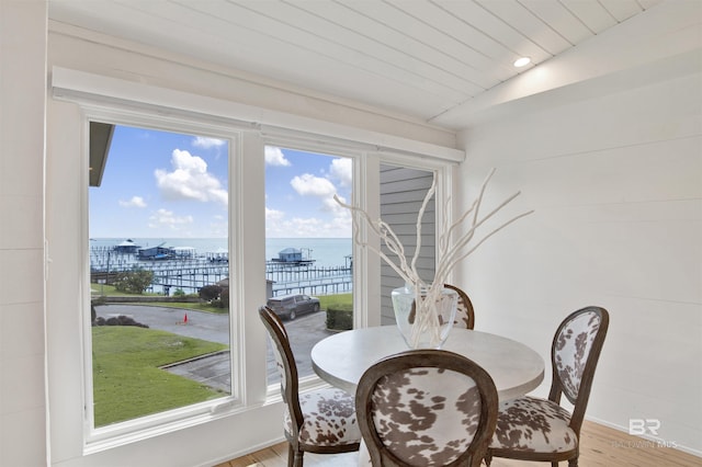 210 S Mobile St Unit 16, Fairhope, AL 36532 - dining room featuring a water view, light wood finished floors, baseboards, and plenty of natural light