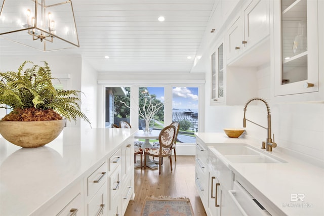 210 S Mobile St Unit 16, Fairhope, AL 36532 - kitchen with light wood-style floors, a chandelier, white cabinetry, light countertops, and recessed lighting