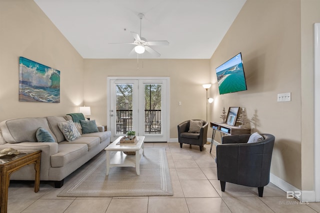 tiled living room with ceiling fan and lofted ceiling