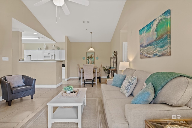 living room with light tile patterned floors, vaulted ceiling, and ceiling fan