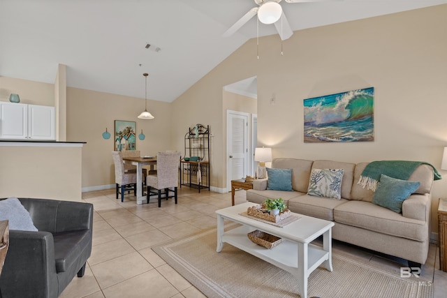 living room with ceiling fan, light tile patterned floors, and high vaulted ceiling