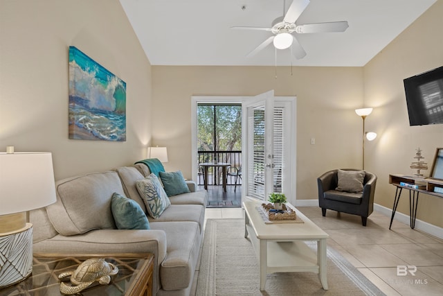 living room featuring light tile patterned floors, french doors, vaulted ceiling, and ceiling fan